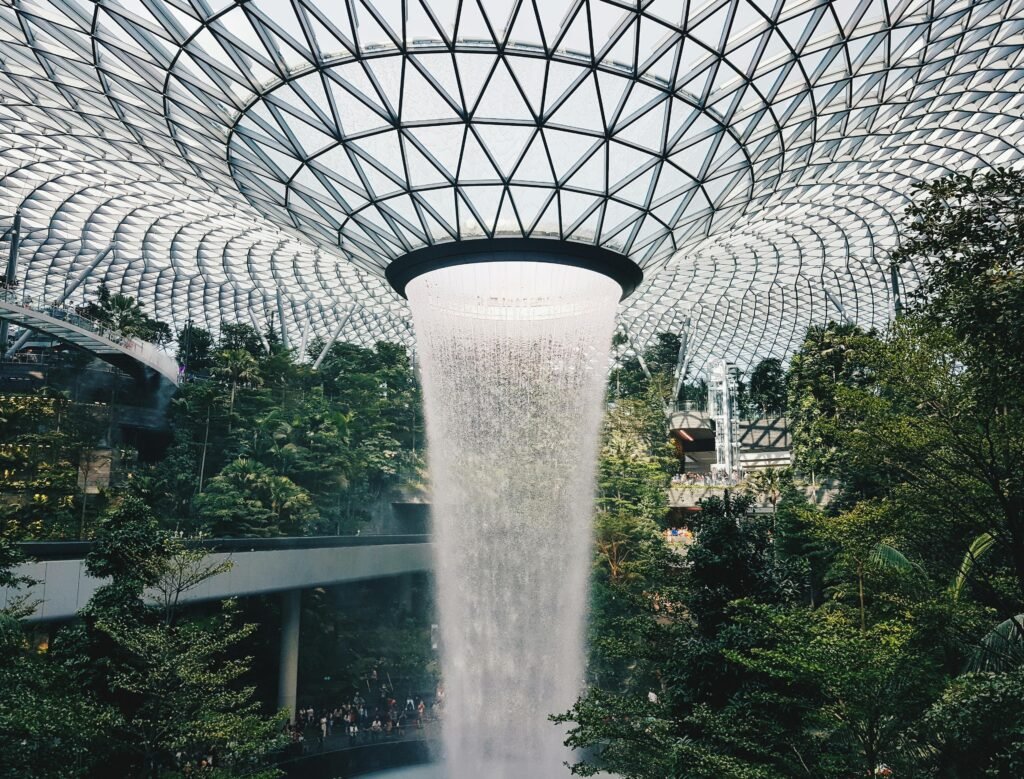 Stunning view of the indoor waterfall at Jewel Changi Airport, Singapore's architectural marvel.
